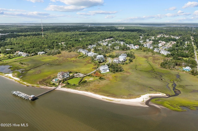 aerial view with a water view and a wooded view