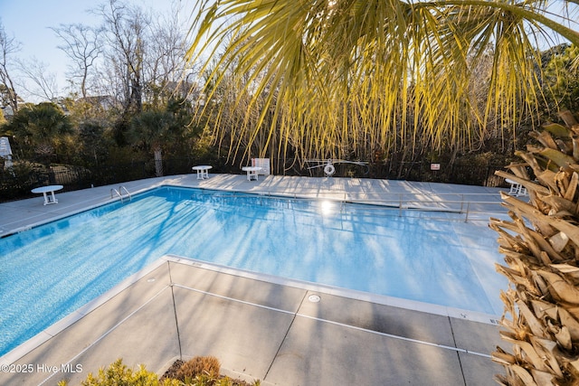 community pool featuring fence
