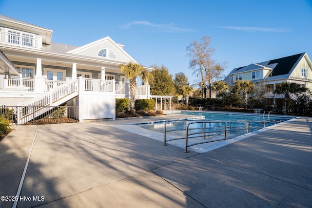 pool featuring fence and stairs