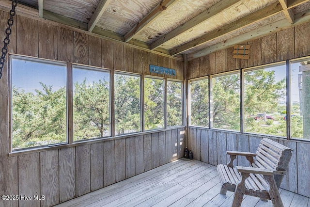 unfurnished sunroom featuring plenty of natural light