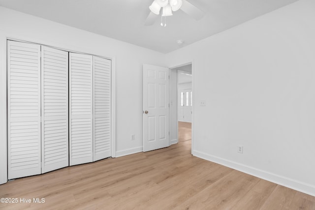 unfurnished bedroom with ceiling fan, light hardwood / wood-style floors, and a closet