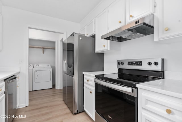 kitchen featuring white cabinets, washer and dryer, appliances with stainless steel finishes, and light hardwood / wood-style flooring