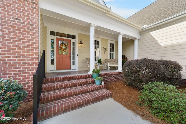 doorway to property with covered porch