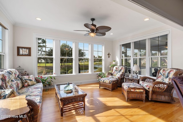 sunroom / solarium with ceiling fan and a wealth of natural light