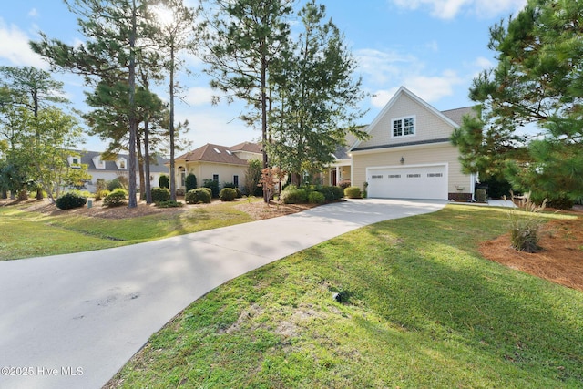 view of front of property with a garage and a front lawn