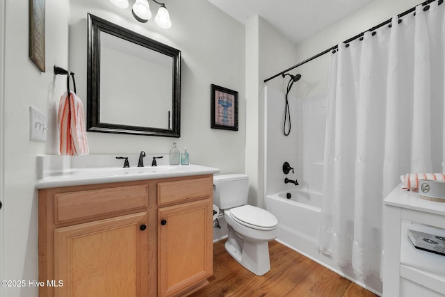 full bathroom with toilet, vanity, wood-type flooring, and shower / bath combo