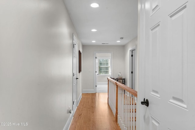 hall with light hardwood / wood-style flooring