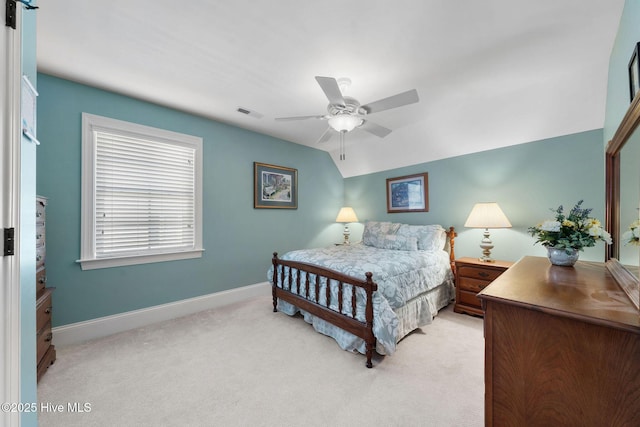 carpeted bedroom featuring ceiling fan and vaulted ceiling