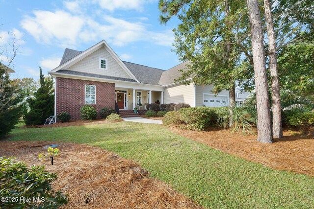 view of property hidden behind natural elements with a front yard and a garage