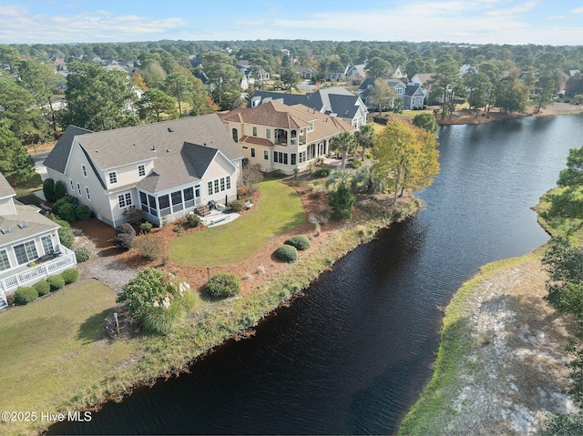 birds eye view of property with a water view