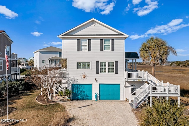 view of front of house with a porch and a garage