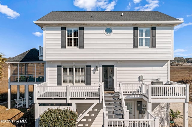 view of front of property featuring a sunroom