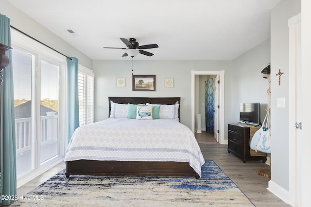 bedroom featuring ceiling fan, access to outside, and light hardwood / wood-style flooring