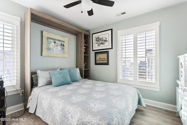 bedroom featuring ceiling fan and hardwood / wood-style floors