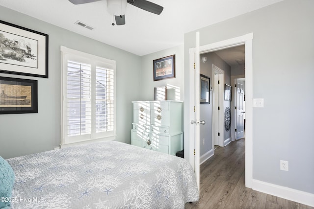 bedroom featuring ceiling fan and wood-type flooring