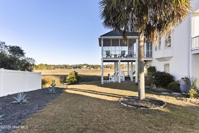 view of yard with a balcony