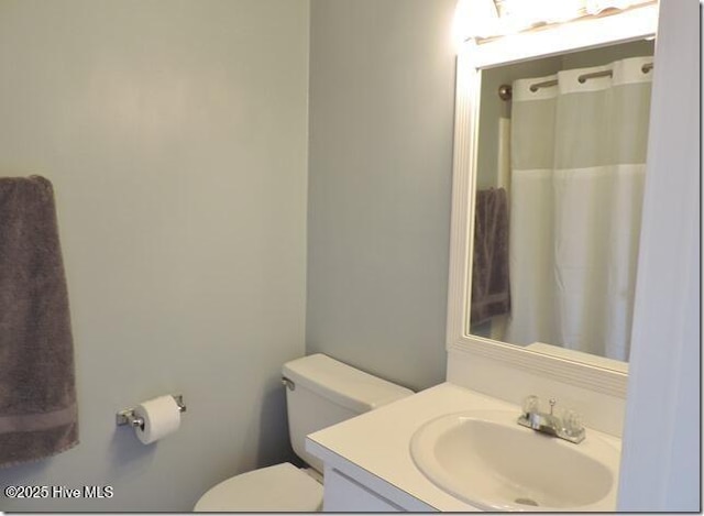 bathroom with vanity and toilet