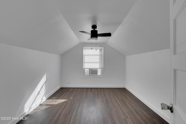 bonus room featuring ceiling fan, dark hardwood / wood-style flooring, lofted ceiling, and cooling unit