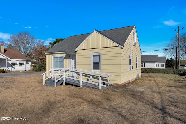 bungalow-style house featuring a front yard