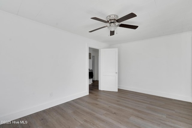 spare room featuring ceiling fan, ornamental molding, and hardwood / wood-style flooring