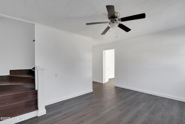 empty room featuring ceiling fan, dark hardwood / wood-style floors, and ornamental molding
