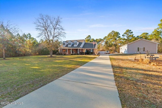 view of front of home with covered porch and a front lawn