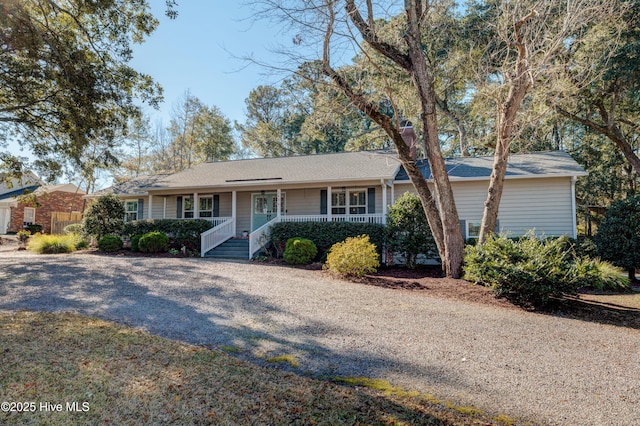 ranch-style home featuring a porch