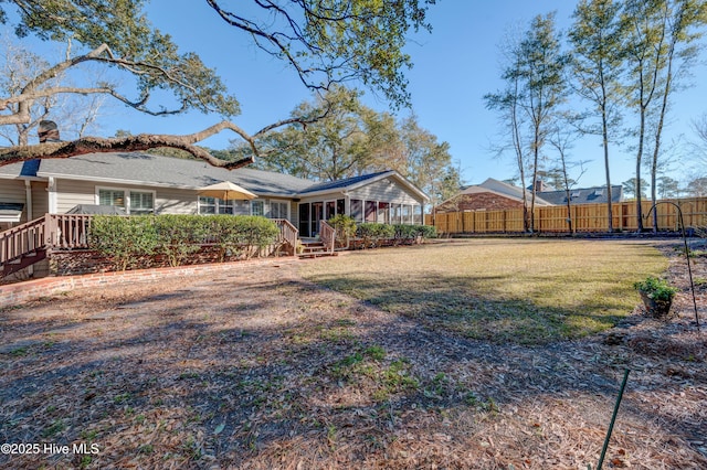 view of yard featuring a sunroom