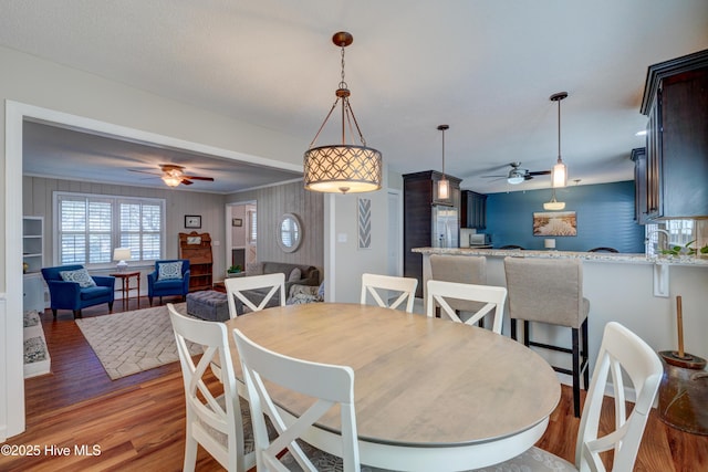 dining room featuring dark wood-type flooring and ceiling fan