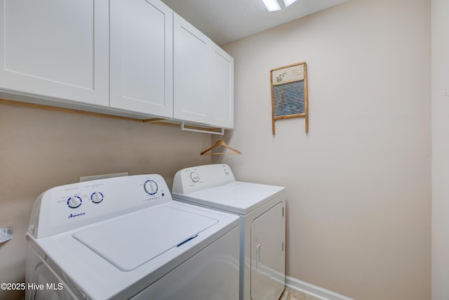 laundry room with cabinets and washing machine and dryer