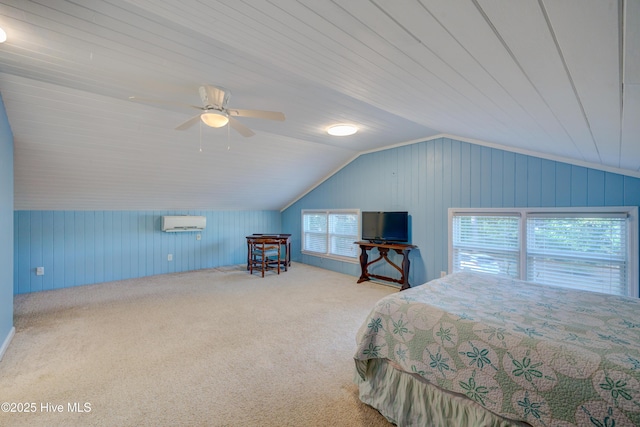 carpeted bedroom featuring vaulted ceiling, a wall mounted air conditioner, and ceiling fan