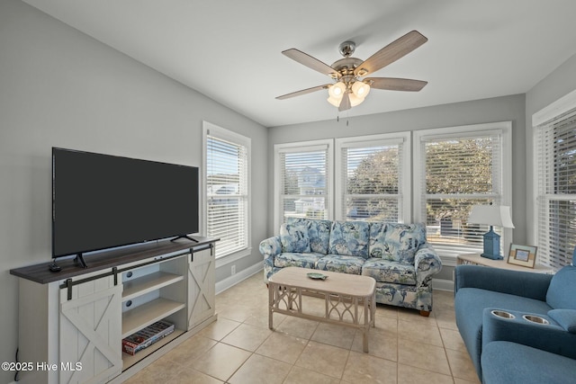 living room featuring ceiling fan and light tile patterned floors