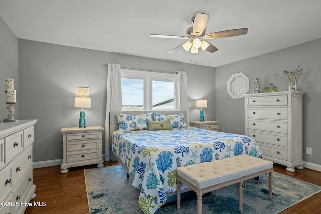 bedroom with dark wood-type flooring and ceiling fan