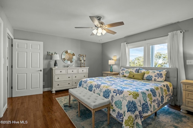 bedroom with ceiling fan and dark hardwood / wood-style flooring