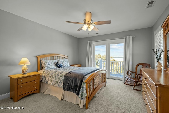 bedroom with ceiling fan, light colored carpet, and access to exterior