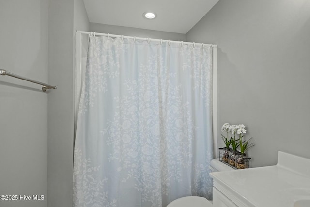 bathroom featuring toilet and vanity