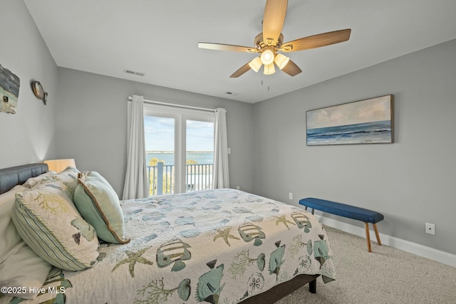 bedroom featuring ceiling fan, access to exterior, and carpet floors