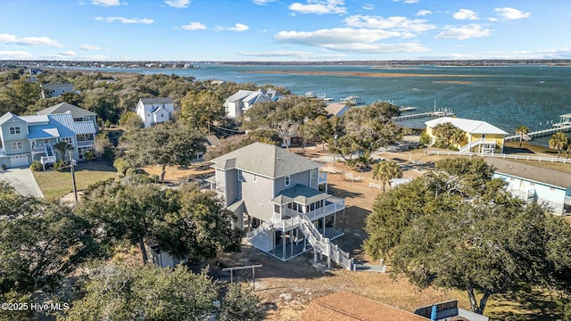 birds eye view of property with a water view