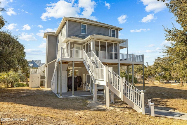 back of house featuring a sunroom