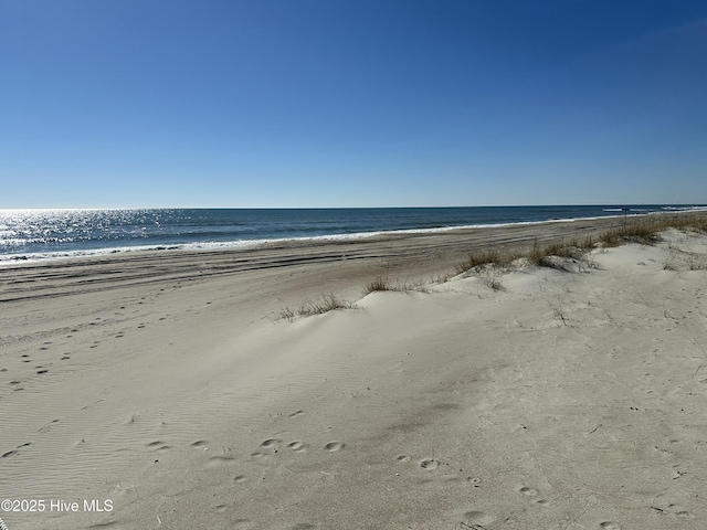 property view of water featuring a view of the beach