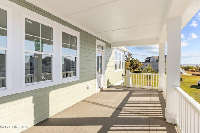 wooden deck featuring covered porch