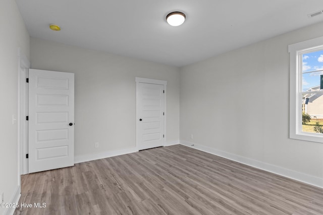 empty room featuring light hardwood / wood-style floors