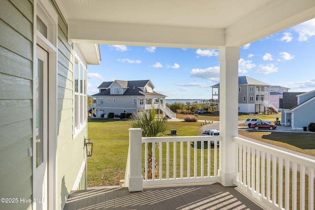 exterior space featuring a porch and a yard