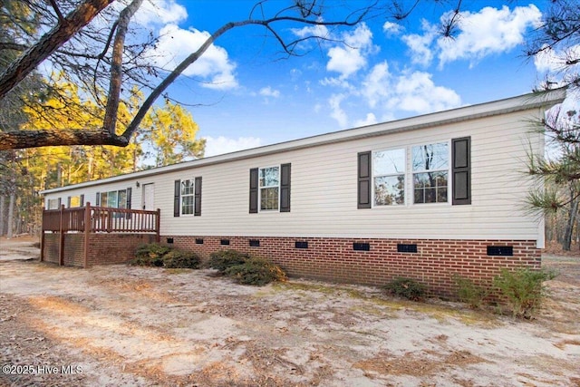 exterior space featuring a wooden deck