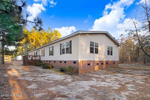 view of side of property with a deck