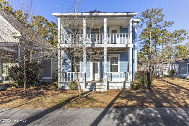 view of front of house with covered porch and a balcony