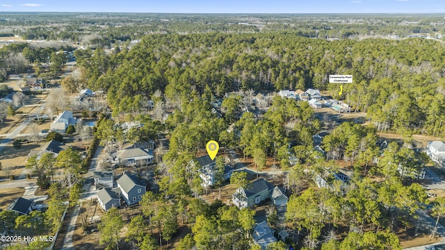 bird's eye view featuring a residential view and a view of trees