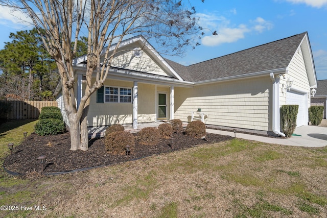 view of front of home featuring a garage and a front yard