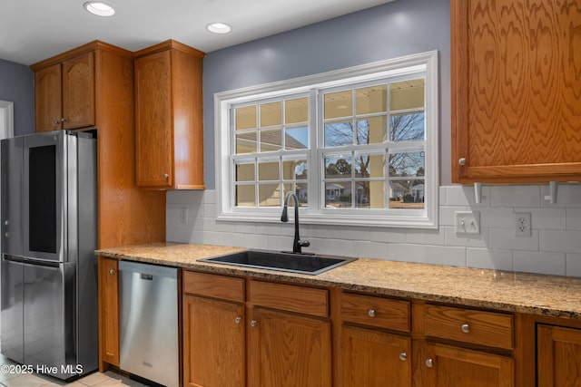 kitchen featuring sink, backsplash, and stainless steel appliances