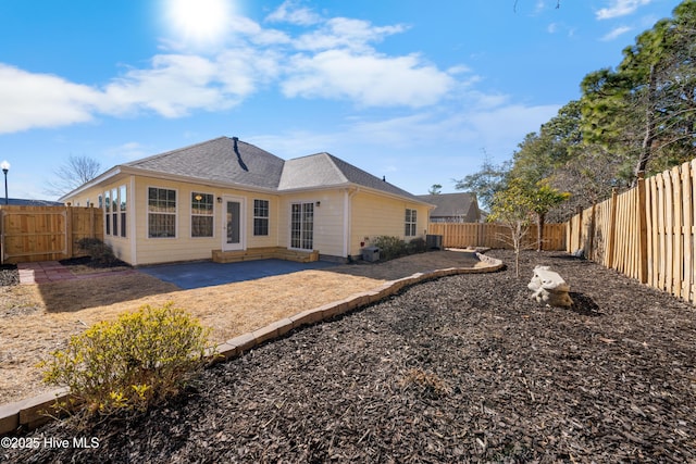 rear view of house with a patio